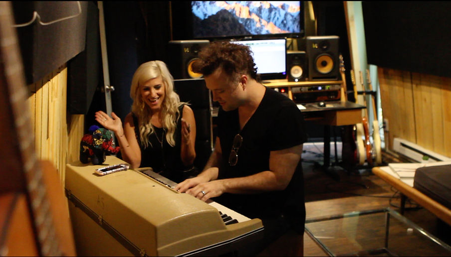 Nathan Walters working with an artist during songwriting and direction